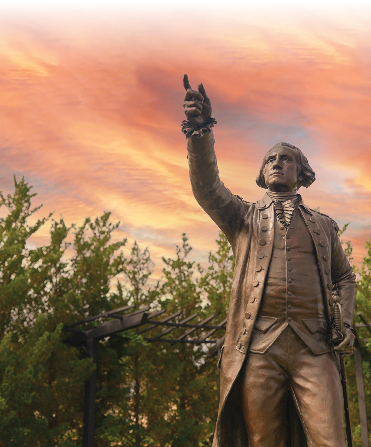 A statue of a man with his hand raised in the air. Description generated by AI