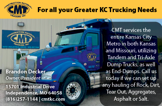 A blue dump truck with a yellow sign on the side. Description generated by AI