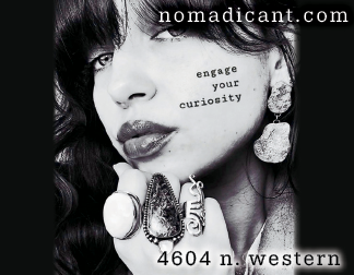 A woman wearing a ring and earrings. Description generated by AI