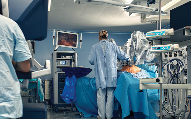 Carrying out an operation using a robot, a robot surgeon with manipulators, a modern operating room, surgeons people perform an operation using a surgeon's robot through the control panel
