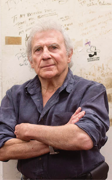 Restauranteur Phil Trani poses for a photograph inside the kitchen of his restaurant where the walls are filled with messages from sports stars throughout the years.   ///ADDITIONAL INFO: lbr.krikorian-trani.0615.dak 06/13/14 - Photo by DREW A. KELLEY, CONTRIBUTING PHOTOGRAPHER