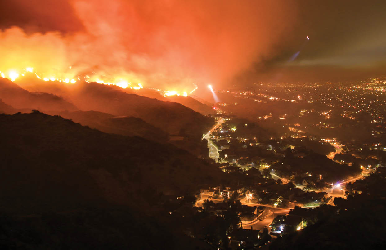 Rescue teams evacuating neighborhood from wildfire