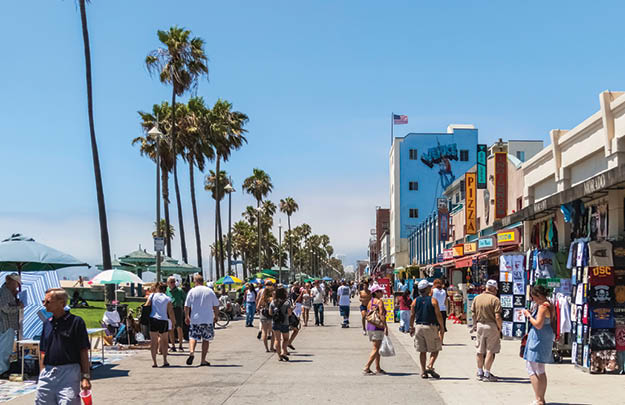 VENICE BEACH, CALIFORNIA - JULY 17, 2007: The crowded boardwalk of Venice Beach in Los Angeles during a sunny and bright day of summer.
