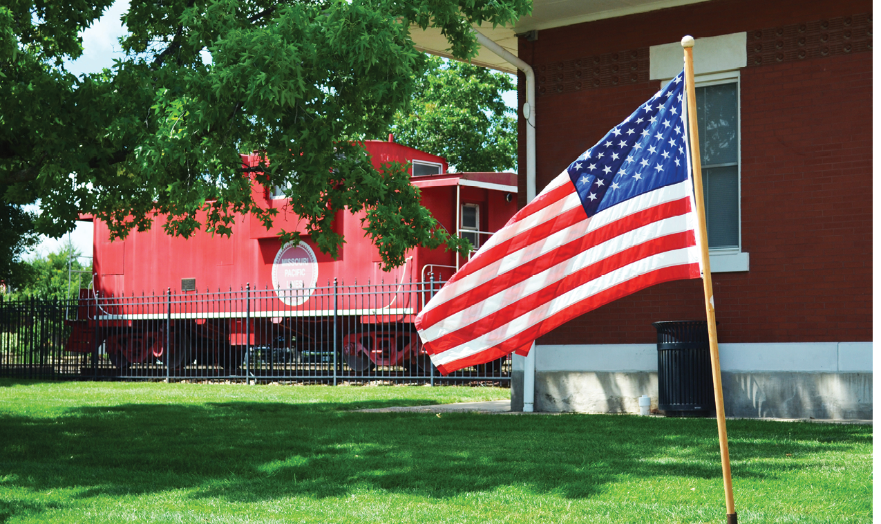 Downtown, LS, flag, u.s., united states flag, caboose, chamber, RR, tracks, railroad, summer,