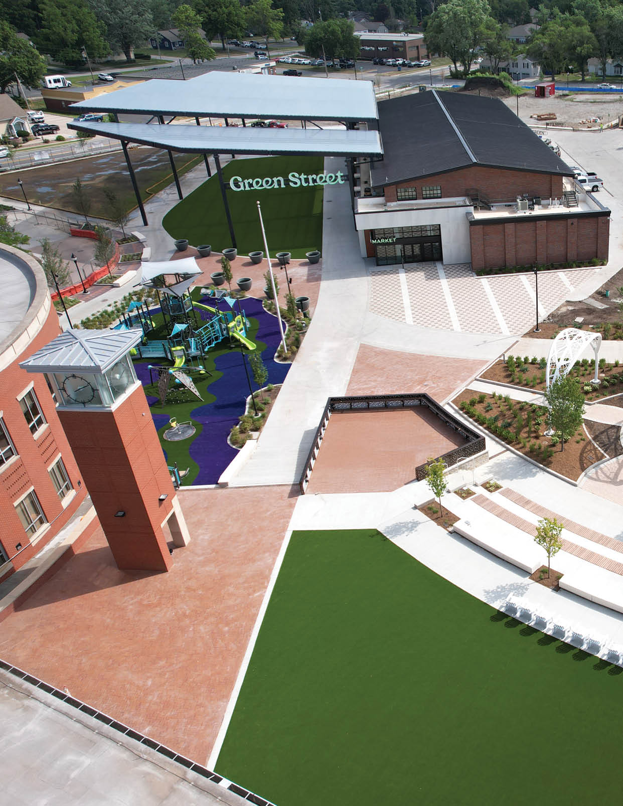 A large park with a fountain and a building in the background. AI generated content