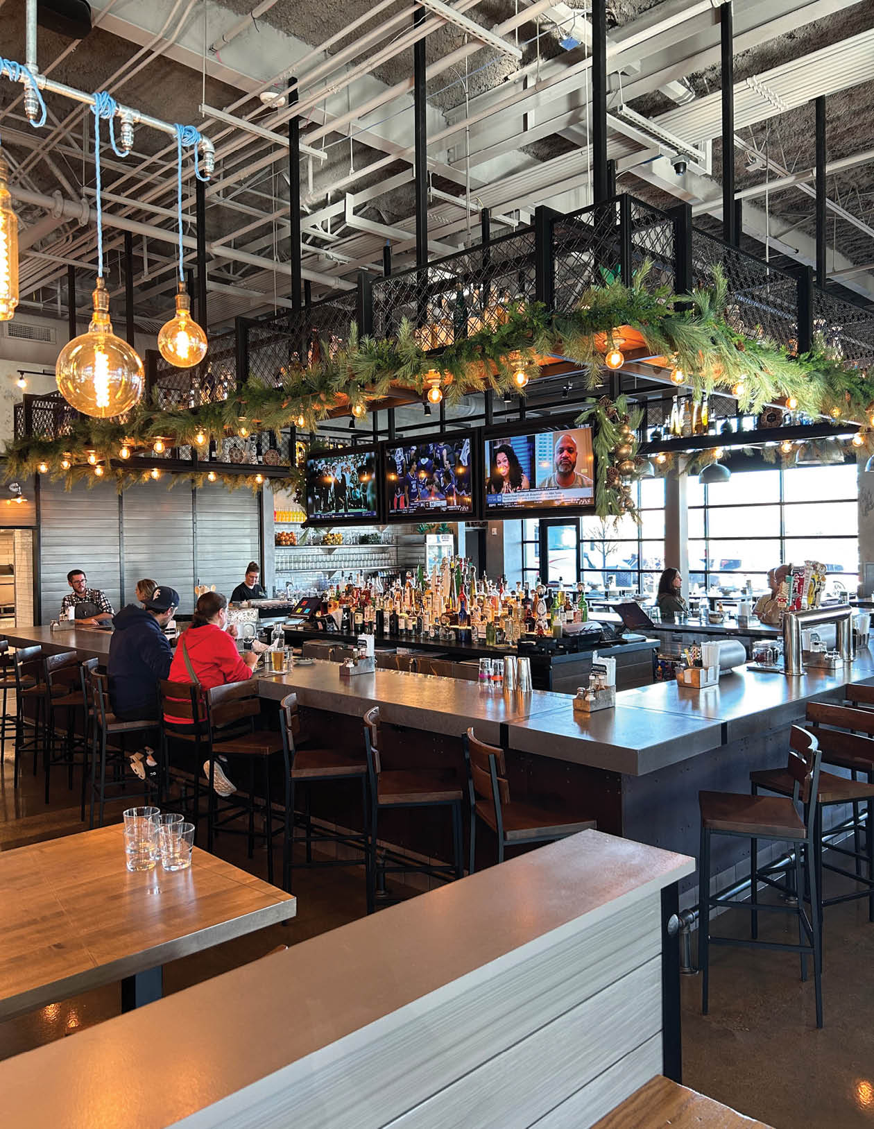 A restaurant with a long bar and several TVs. AI generated content