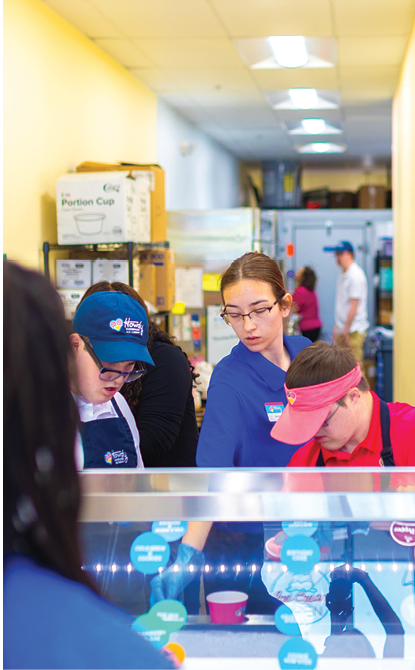A group of people are standing in line at a food stand. AI generated content