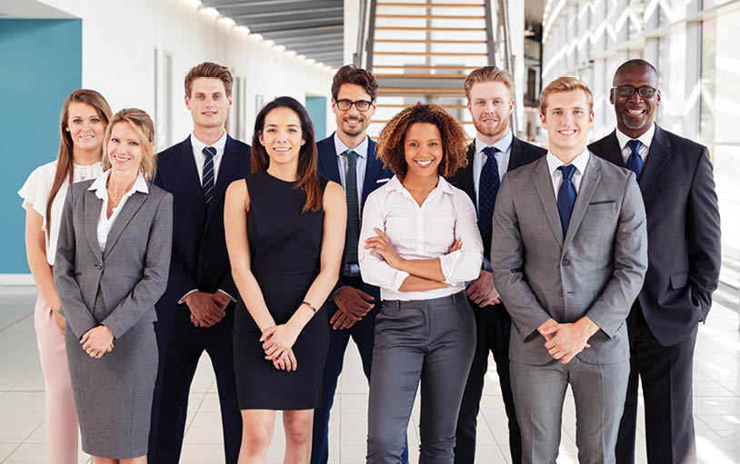 Office workers in a modern lobby, group portrait