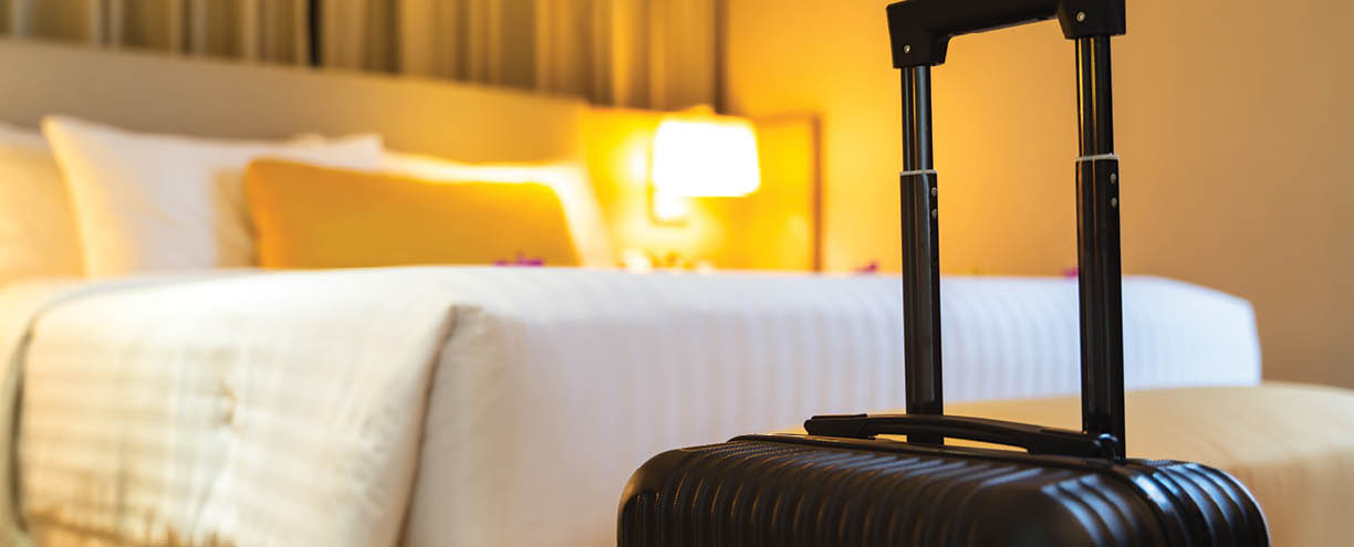 Suitcase delivered standing in hotel room. concept of Hotel service and travel
