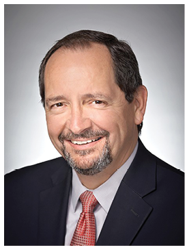 A man wearing a suit and tie is smiling and has a beard. AI generated content
