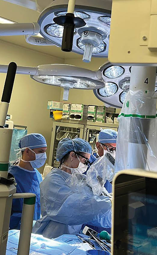 A group of doctors wearing blue scrubs are working on a patient in a hospital room. AI generated content