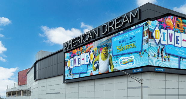 A large billboard with cartoon characters and the words “American Dream" on it. AI generated content