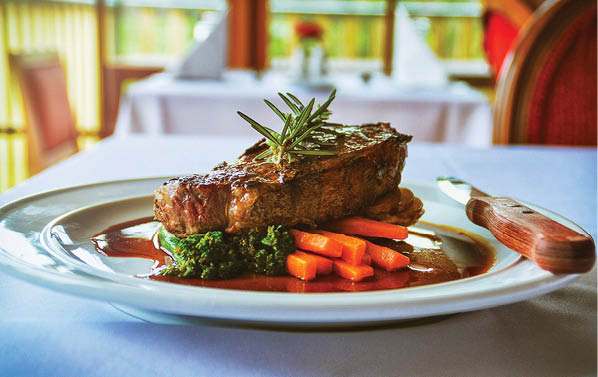 A plate of food with meat, potatoes, and broccoli on a dining table. AI generated content