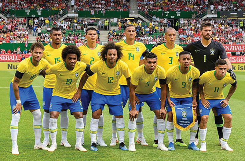 A group of soccer players in blue and yellow uniforms pose for a picture on the field. AI generated content