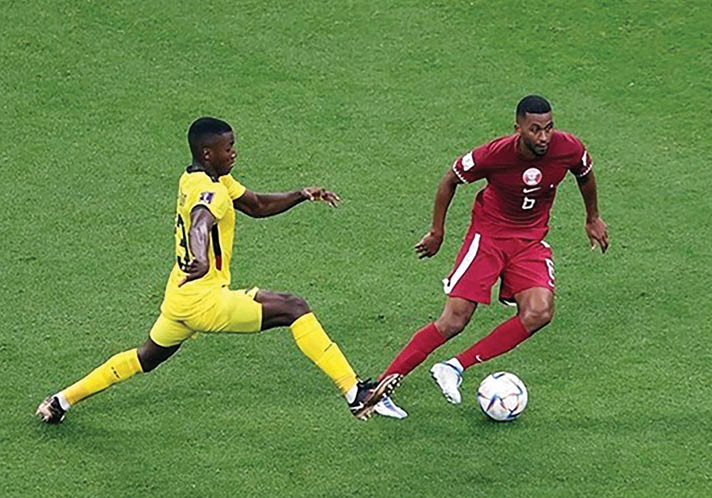 Two soccer players are running on the field, one in a yellow jersey and the other in a red jersey. AI generated content