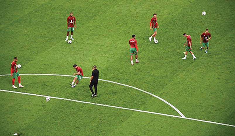 A group of men playing soccer on a field. AI generated content