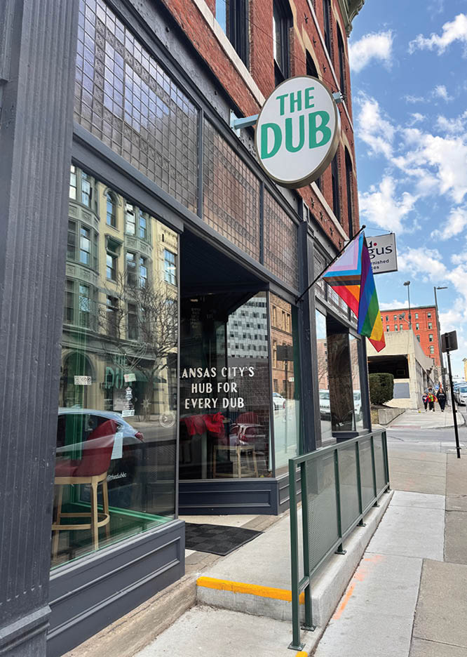 A restaurant with a sign that says “The Dub". Description generated by AI