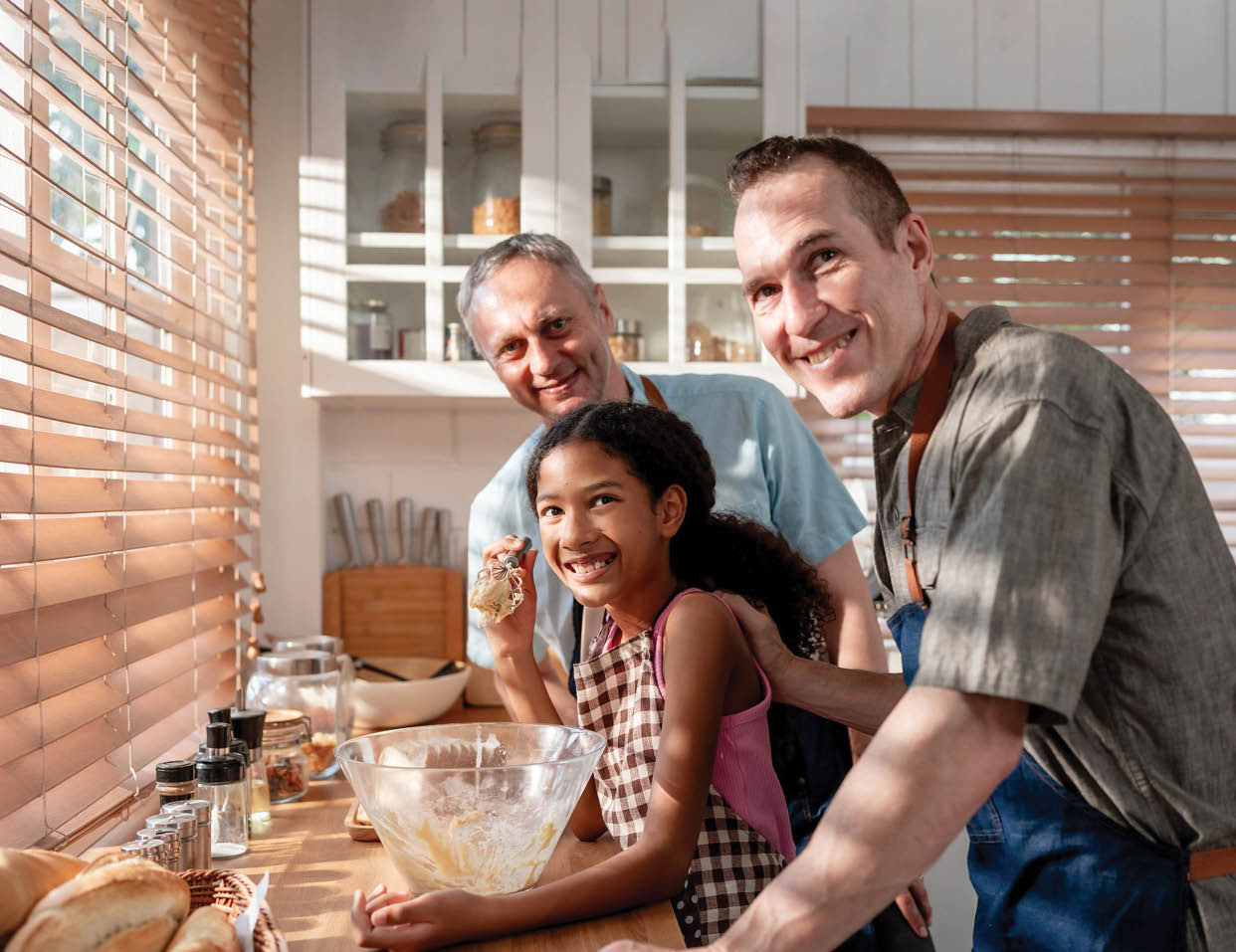 A man and a girl are making bread together. Description generated by AI