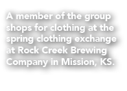A member of the group shops for clothing at the spring clothing exchange at Rock Creek Brewing Company in Mission, KS.