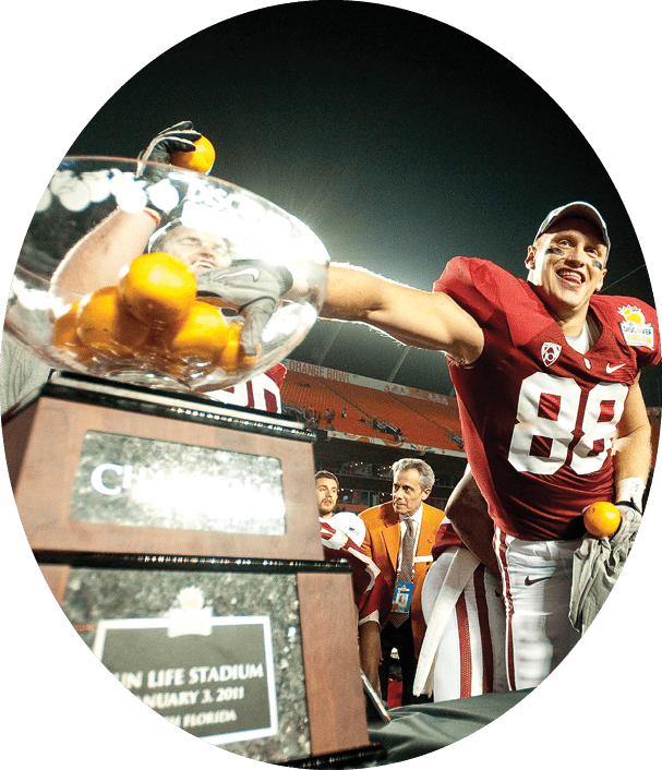 MIAMI GARDENS, FL--Konrad Reuland grabs an orange as the Stanford Cardinal celebrates their win over Virginia Tech at the Discover Orange Bowl at Sun Life Stadium in Miami Gardens, Florida.