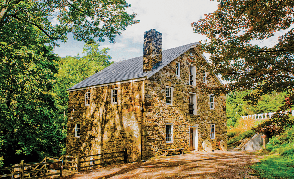 An exterior view of the Cooper Gristmill from the parking lot.