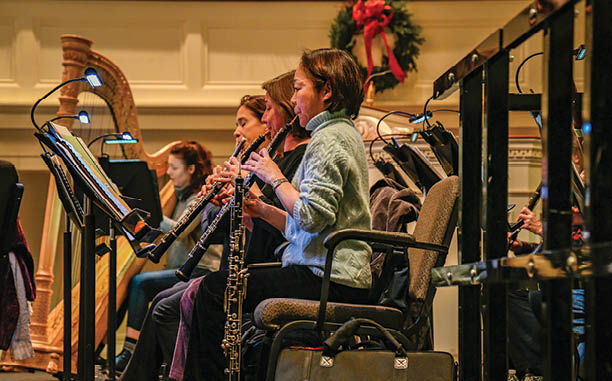 An interior view of clarinet players rehearsing for a concert