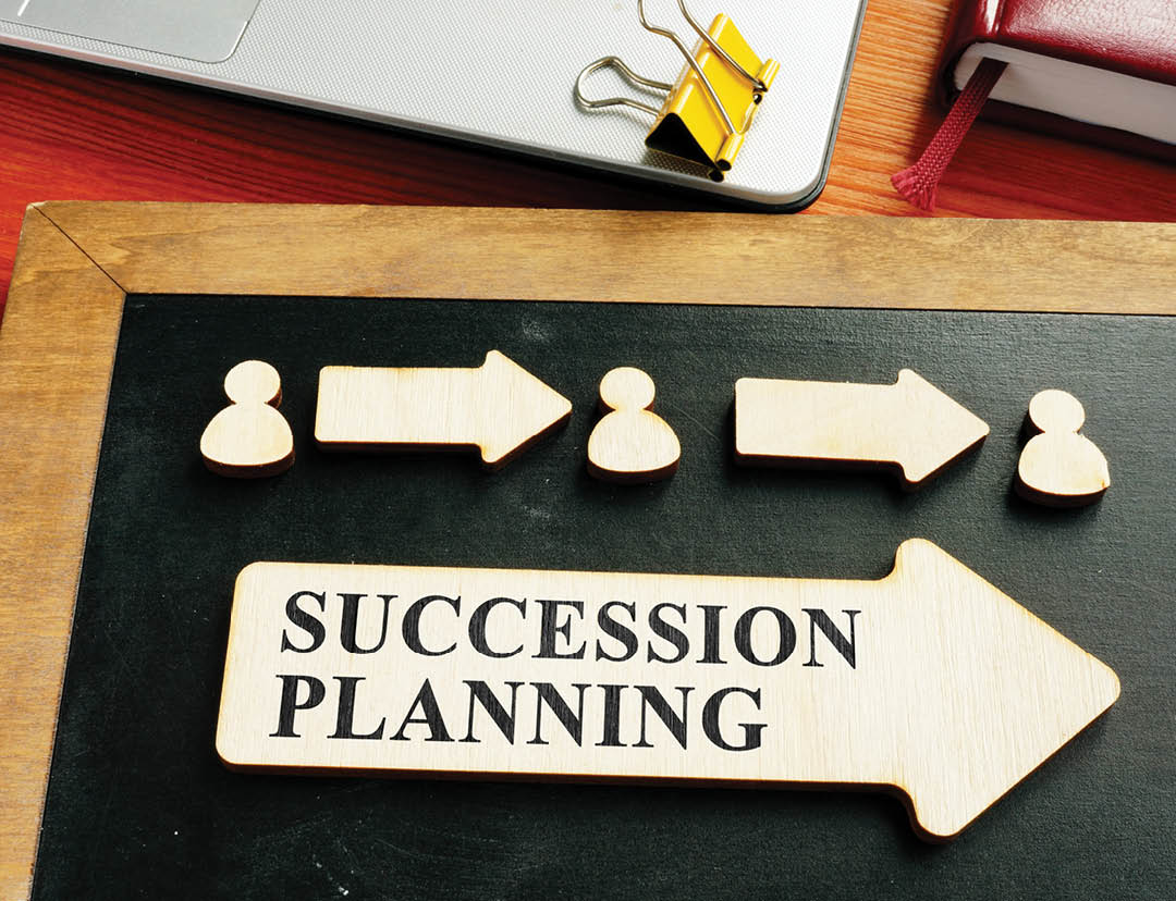 Succession planning concept. Wooden figures and arrows.