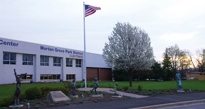 A flag pole with an American flag on it. Description generated by AI