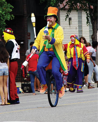 Medinah Clowns perform at the parade  Medinah Shriners   this one is riding a unicycle