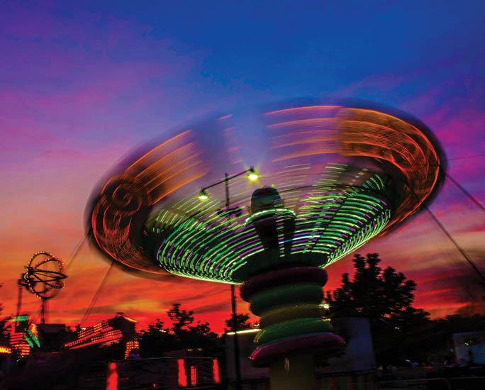 The swings ride (with light trails showing) at the Carnival    Art Piece   snl effect   saturday night live effect