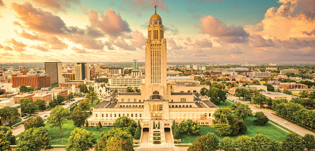 Lincoln skyline and Nebraska State Capitol. The Nebraska State Capitol is the seat of government for the U.S. state of Nebraska and is located in downtown Lincoln.