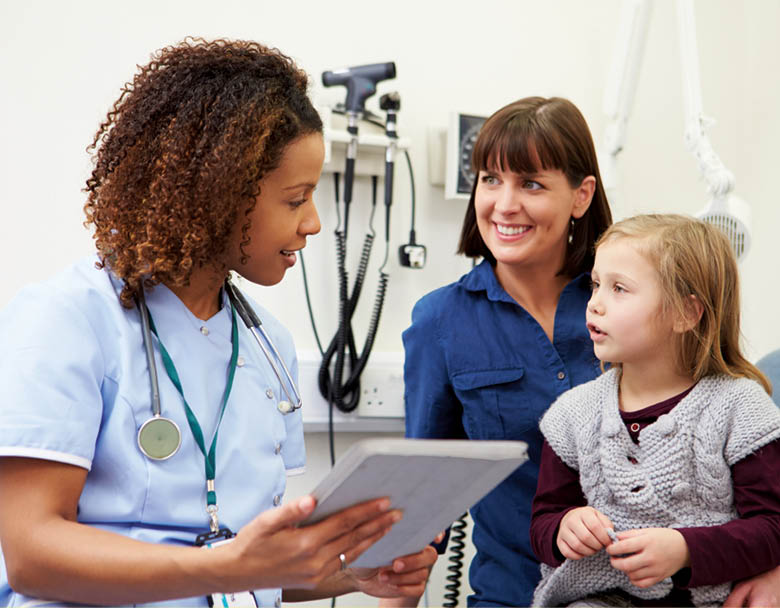 Appointment For Mother And Daughter With Nurse In Clinic Using Digital Tablet