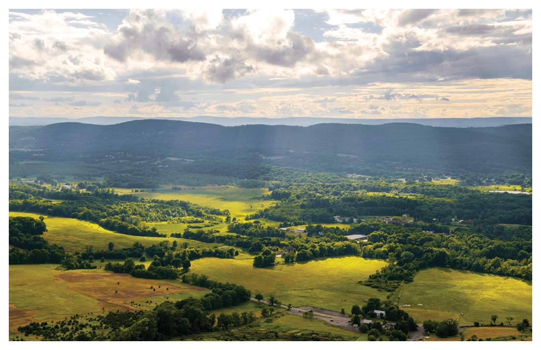 Sun rays over Vernon, New Jersey landscape viewed from Pinwheel Vista