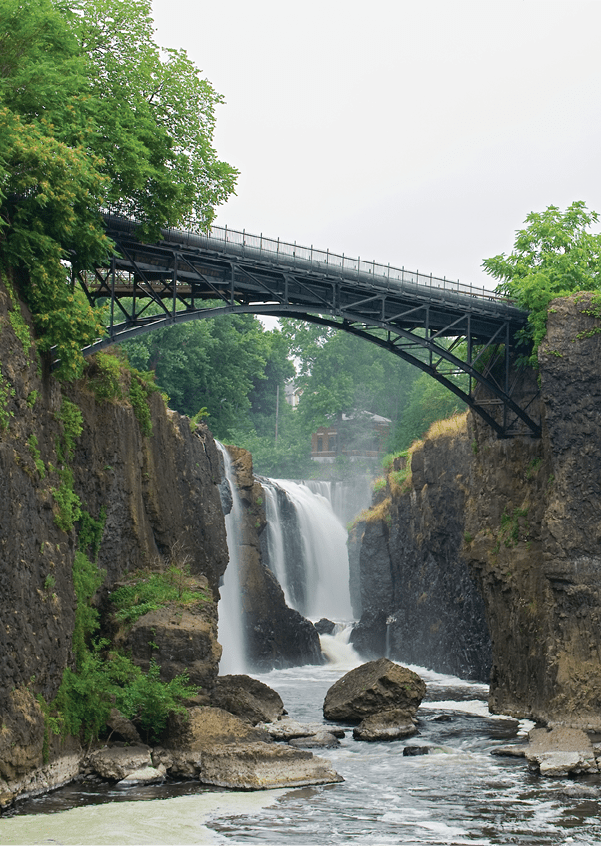 Paterson, NJ / USA - 7/8/20: Landscape view of the Great Falls of the Passaic River. a prominent waterfall, 77 feet (23 m) high, on the Passaic River in the city of Paterson in Passaic County.