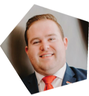 A man wearing a suit and tie is smiling for the camera. AI generated content