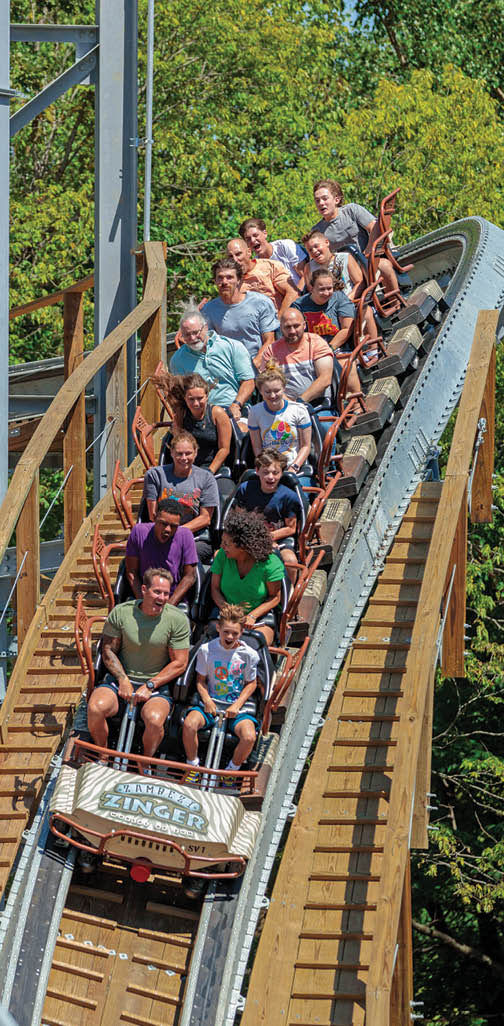 A group of people are riding a roller coaster, enjoying the thrill of the ride. AI generated content