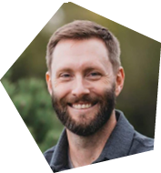 A man with a beard and mustache is smiling for the camera. AI generated content