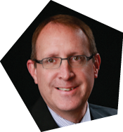 A man wearing a suit and tie is smiling for the camera. AI generated content