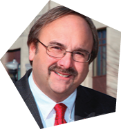 A man wearing a suit and tie with a red tie and glasses. AI generated content