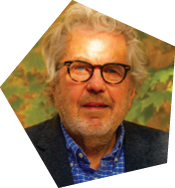 A man wearing glasses and a blue shirt stands in front of a tree. AI generated content