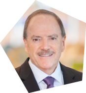 A man wearing a suit and tie is smiling for the camera. AI generated content