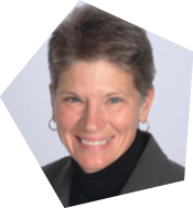 A woman wearing a black shirt and a gray jacket is smiling for the camera. AI generated content