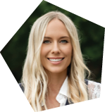 A woman with blonde hair and a white shirt is smiling. AI generated content