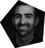A man with a beard and mustache is smiling for the camera. AI generated content