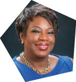A woman wearing a blue shirt and gold necklace is smiling for the camera. AI generated content