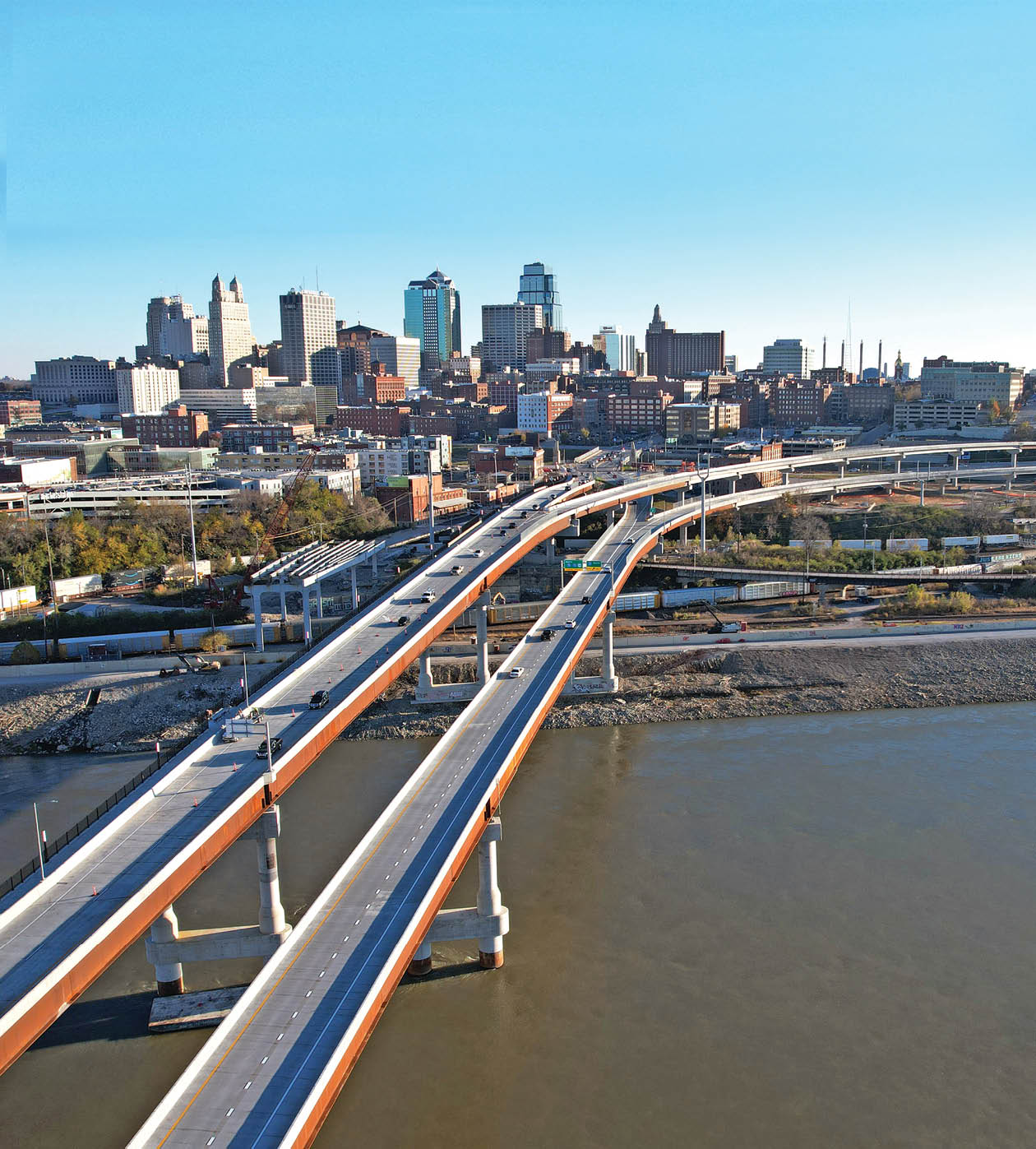 A bridge over a river with a city in the background. AI generated content
