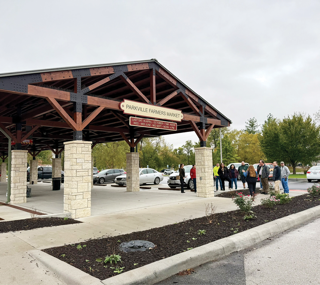 A group of people are standing under a covered area in a parking lot. AI generated content