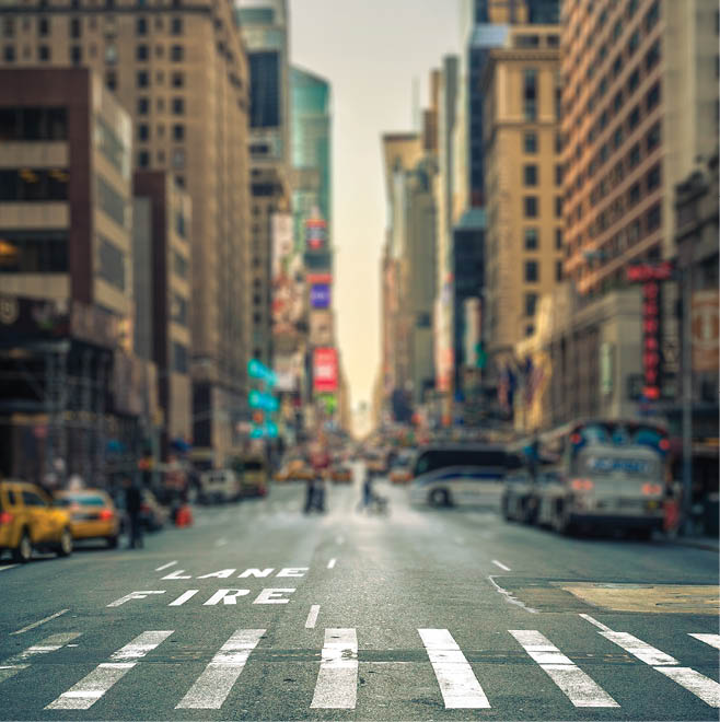 Tilt-shift view of a crosswalk in a New-York city avenue, USA