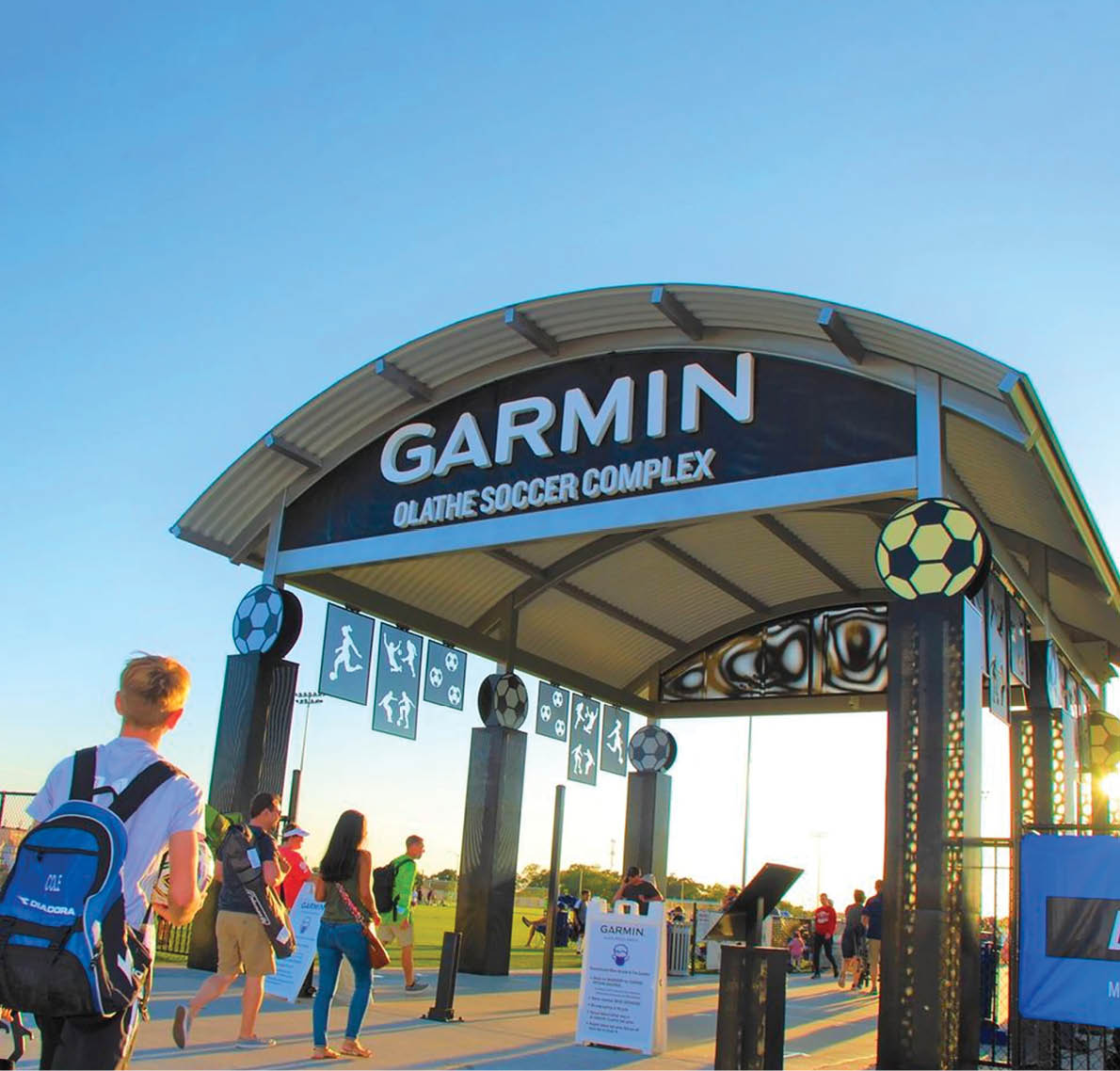 People walking under a Garmin sign. AI generated content