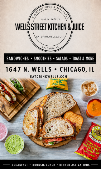 A sandwich on a wooden board with a green spread. Description generated by AI